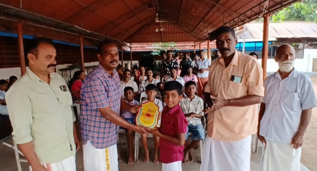 Abhayadev, a student of class 3, was welcomed by Vembanad backwater swimming record holder with both hands.
